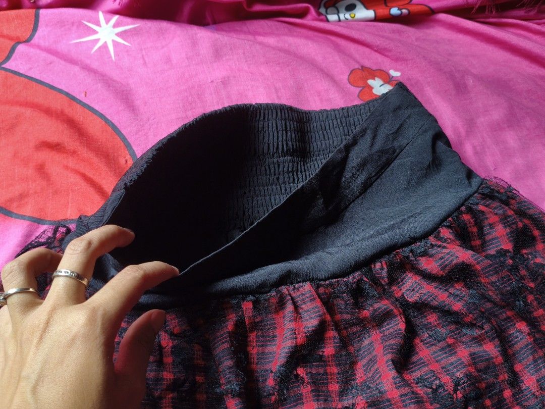 punk style skirt (Category: Skirts) located in Manila. Submitted by avwilynn (Listing ID 1469601488, Image 2). Description: *Red & Black Plaid Mini Skirt with Black Lace Overlay* Grunge / punk style skirt, thrifted. *Details:* - *Color:* Red and black checkered plaid, with black lace overlay on top - *Cut:* Mini length, flared / pleated, high-waisted with wide black waistband - *Waist:* Smocked / garterized at back (stretchy) + flat front panel, 