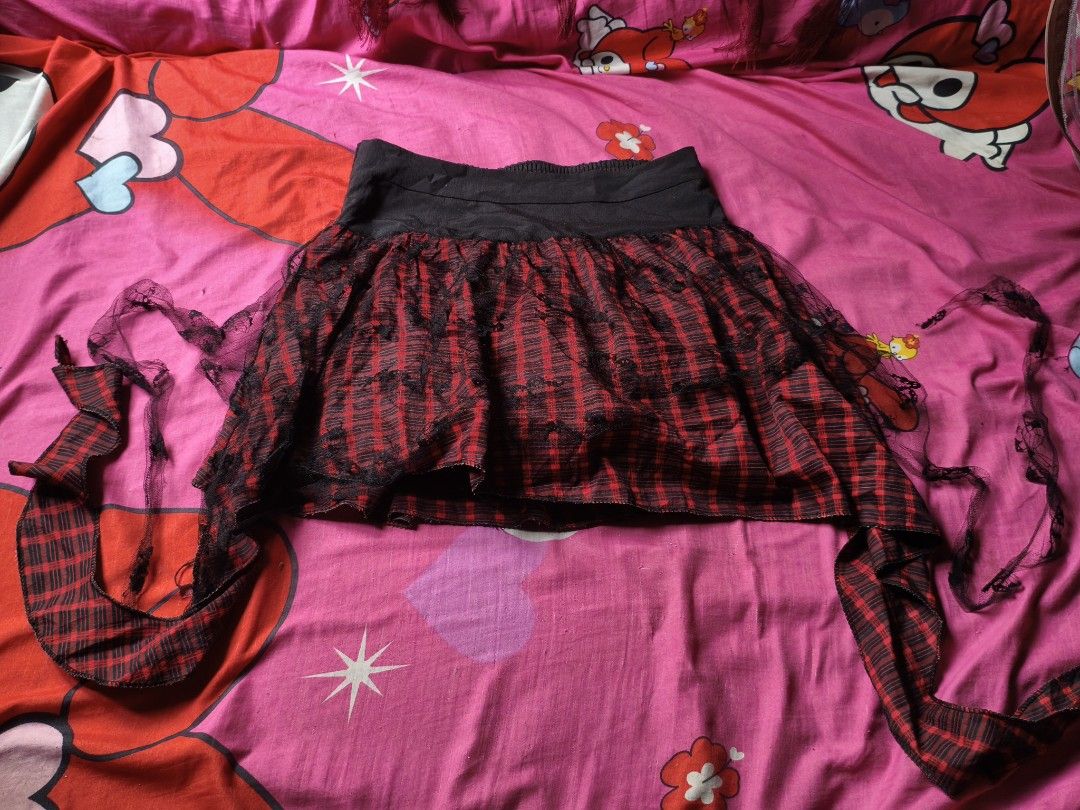 punk style skirt (Category: Skirts) located in Manila. Submitted by avwilynn (Listing ID 1469601488, Image 1). Description: *Red & Black Plaid Mini Skirt with Black Lace Overlay* Grunge / punk style skirt, thrifted. *Details:* - *Color:* Red and black checkered plaid, with black lace overlay on top - *Cut:* Mini length, flared / pleated, high-waisted with wide black waistband - *Waist:* Smocked / garterized at back (stretchy) + flat front panel, 