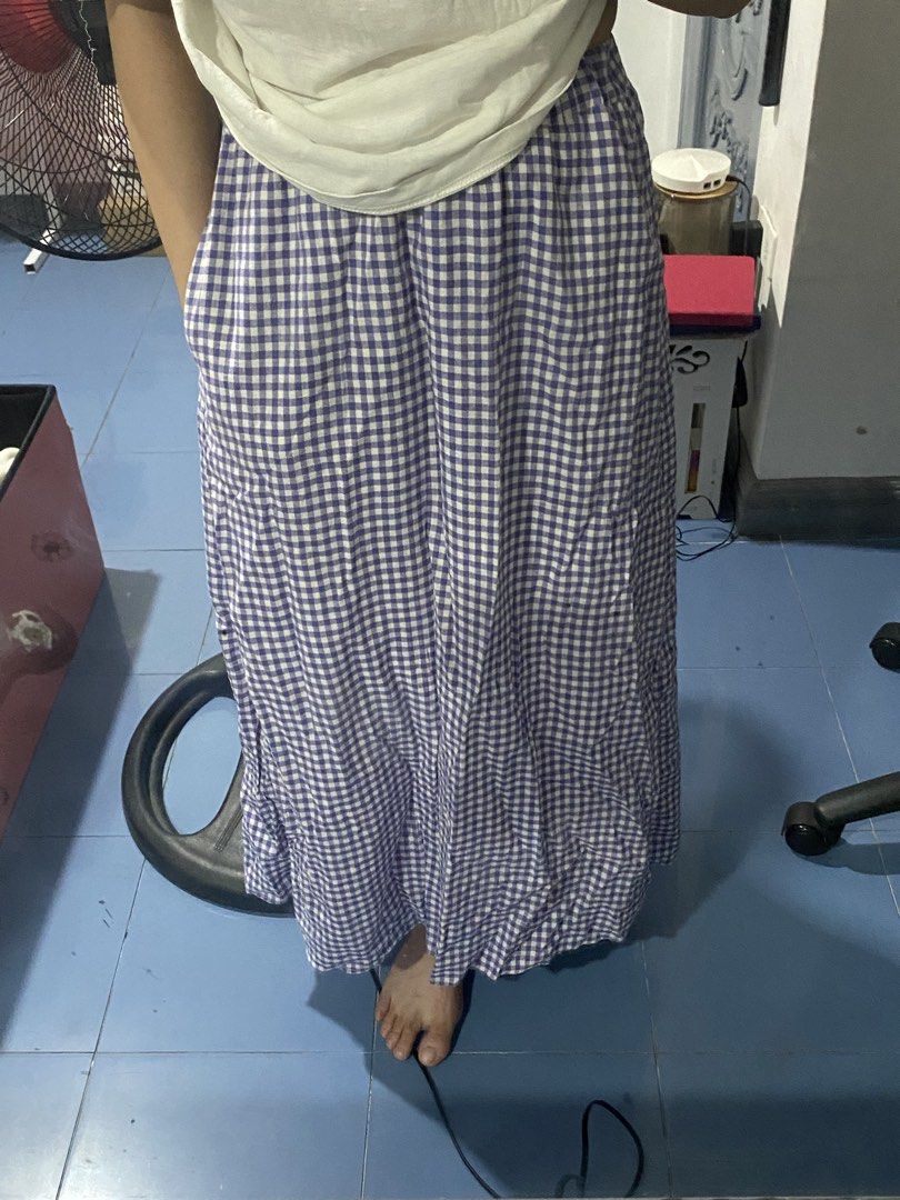 Purple and White Gingham Long Skirt (Category: Skirts) located in Bulacan. Submitted by nonu_sells (Listing ID 1469672803, Image 1). Description: - Style: Purple and white gingham long skirt - Waist: Comfortable elastic waistband - Length: Maxi style, reaches past the ankles on average height - Material: Lightweight, perfect for warm weather - Versatility: Easy to pair with plain t-shirts or crop tops.