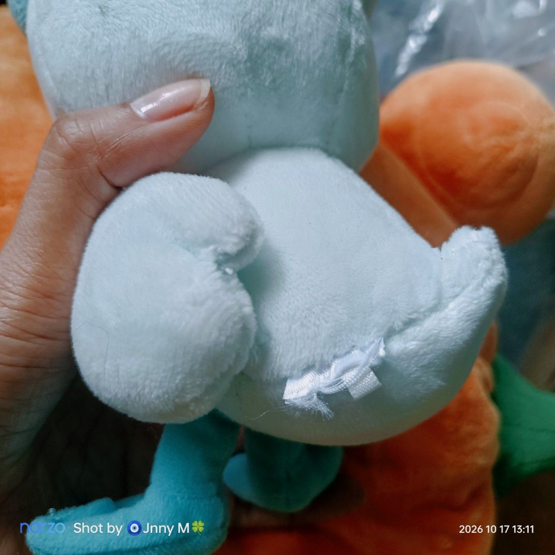 Quaxly Pokémon Plush Toy (Category: Plushies & Soft Toys) located in Taguig. Submitted by mhayestufftoys (Listing ID 1469589181, Image 2). Description: - Character: Quaxly from Pokémon - Design: Light blue duck with embroidered blue eyes, yellow bill, and signature big hair tuft - Material: Soft and cuddly plush all over - Size: Handheld, perfect for display or on-the-go - Condition: Tag is cut off at the back, otherwise clean and well-kept.