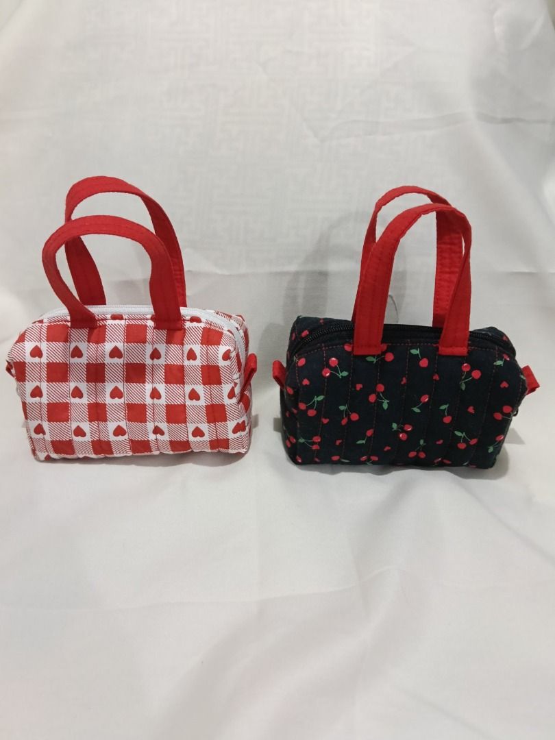 Quilted Mini Pouch with handle (Category: Purses & Pouches) located in Caloocan City. Submitted by wisedolphin_d6fc90 (Listing ID 1469630223, Image 3). Description: - Mini quilted pouches with top handle and zipper closure - Soft, padded fabric with structured stitching - Compact size fits daily essentials like lipstick, compact powder, or small digital cameras - Available designs: Printed Design - Handmade and ready to ship - Mode of payment: GC