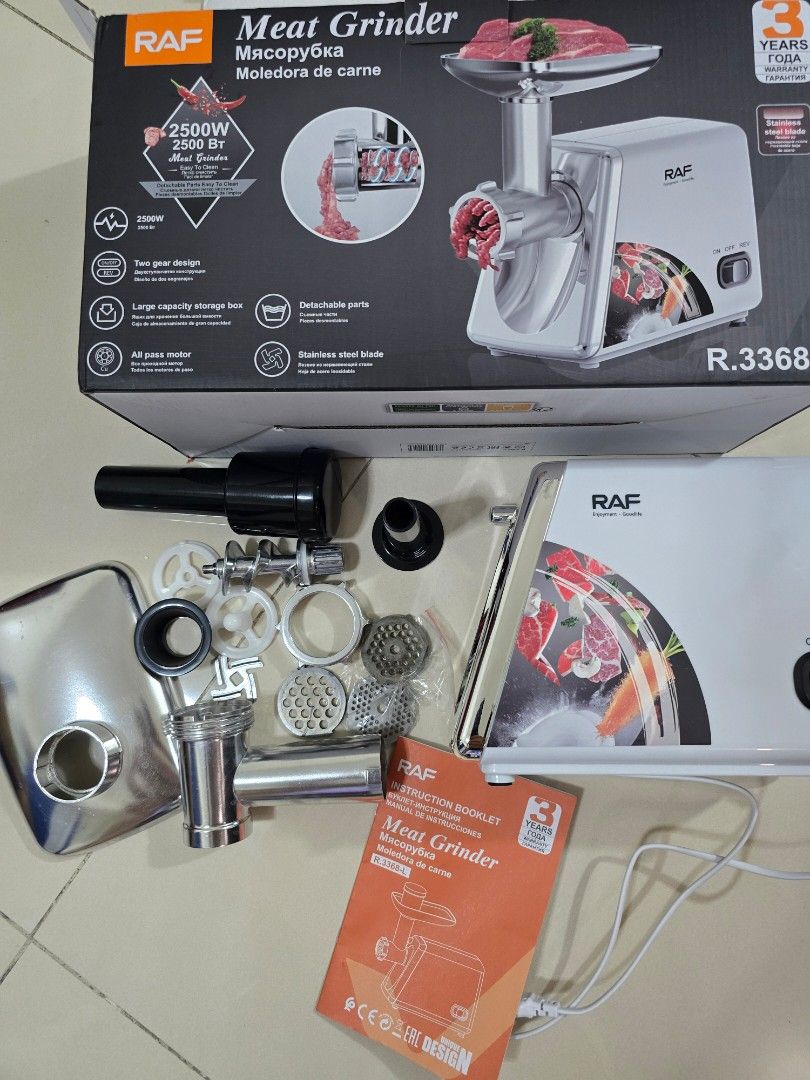 RAF Meat Grinder 2500W (Category: Juicers, Blenders & Grinders) located in Quezon City. Submitted by happy_gut_store (Listing ID 1469694607, Image 3). Description: - Brand: RAF Heavy-Duty Meat Grinder - Model: R.3368-L - Motor Power: 2500W for fast and efficient grinding - Inclusions: Multiple stainless steel cutting blades, grinding plates, food pusher, hopper plate, and instruction booklet - Packaging: Comes with the original box - Condition: C