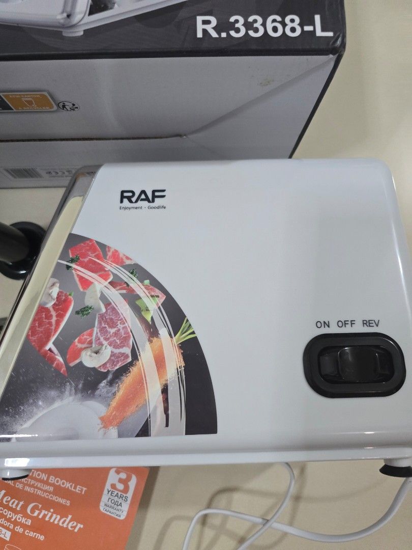 RAF Meat Grinder 2500W (Category: Juicers, Blenders & Grinders) located in Quezon City. Submitted by happy_gut_store (Listing ID 1469694607, Image 2). Description: - Brand: RAF Heavy-Duty Meat Grinder - Model: R.3368-L - Motor Power: 2500W for fast and efficient grinding - Inclusions: Multiple stainless steel cutting blades, grinding plates, food pusher, hopper plate, and instruction booklet - Packaging: Comes with the original box - Condition: C