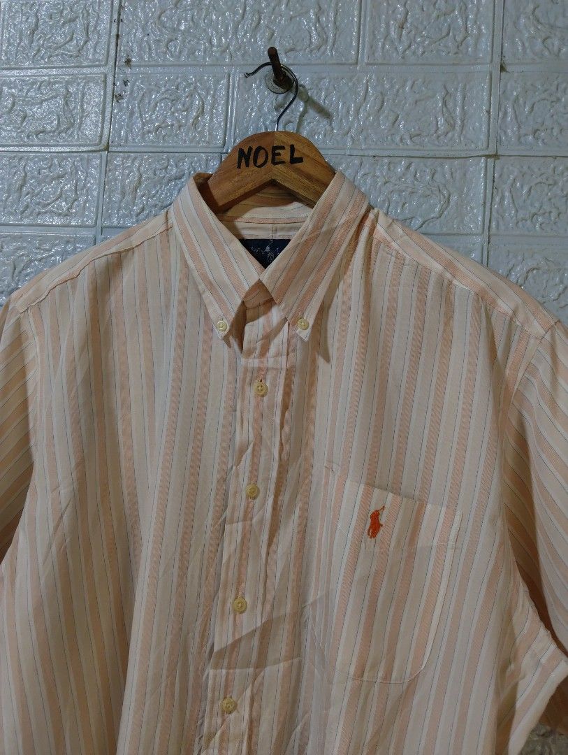 Ralph Lauren Custom Fit Striped Button-Down Shirt XL (Category: Tshirts & Polo Shirts ) located in Davao. Submitted by noelamihan05424 (Listing ID 1469617549, Image 2). Description: - Brand: Ralph Lauren - Style: Custom fit short-sleeve button-down shirt - Pattern: Orange, white, and blue vertical stripes - Size: XL Best fit to XXL - Dimes 25x31 - Material: 100% cotton (Made in Hong Kong) - Details: Button-down collar, single chest pocket with em