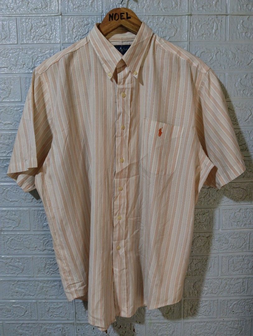 Ralph Lauren Custom Fit Striped Button-Down Shirt XL (Category: Tshirts & Polo Shirts ) located in Davao. Submitted by noelamihan05424 (Listing ID 1469617549, Image 1). Description: - Brand: Ralph Lauren - Style: Custom fit short-sleeve button-down shirt - Pattern: Orange, white, and blue vertical stripes - Size: XL Best fit to XXL - Dimes 25x31 - Material: 100% cotton (Made in Hong Kong) - Details: Button-down collar, single chest pocket with em