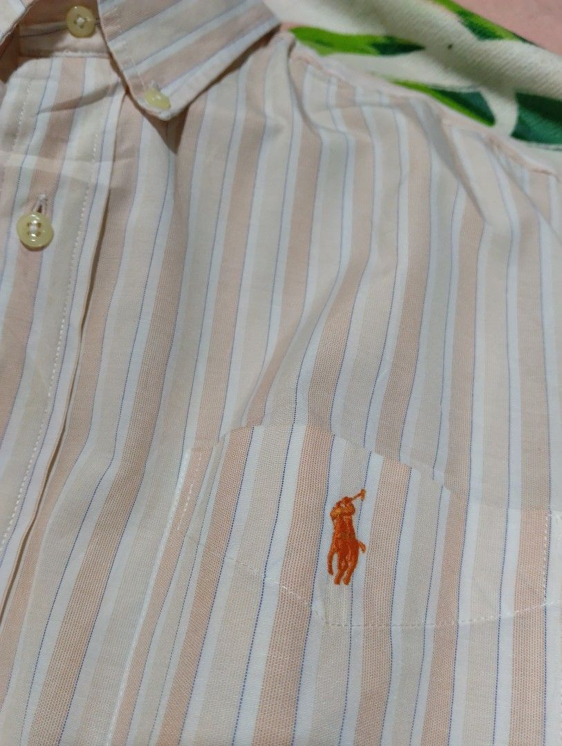 Ralph Lauren Custom Fit Striped Button-Down Shirt XL (Category: Tshirts & Polo Shirts ) located in Davao. Submitted by noelamihan05424 (Listing ID 1469617549, Image 3). Description: - Brand: Ralph Lauren - Style: Custom fit short-sleeve button-down shirt - Pattern: Orange, white, and blue vertical stripes - Size: XL Best fit to XXL - Dimes 25x31 - Material: 100% cotton (Made in Hong Kong) - Details: Button-down collar, single chest pocket with em