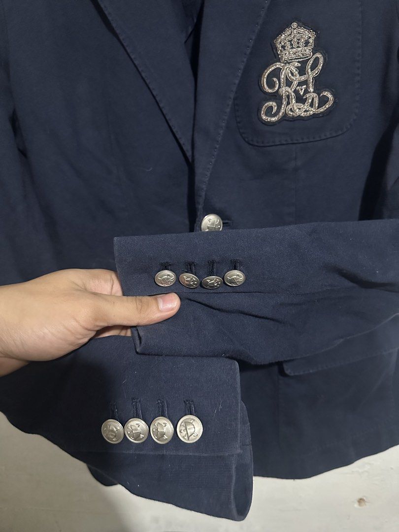Ralph Lauren Navy Blue Crest Blazer Jacket Size 4 (Category: Coats, Jackets and Outerwear) located in Quezon City. Submitted by jeconiah.tayuman (Listing ID 1469661033, Image 3). Description: Size 4 17x25 Missing one button Excellent Condition DM 📩 Authentic Ralph Lauren navy blue blazer - Tailored fit with structured shoulders for a polished look - Distinctive embroidered crown and RL logo crest patch - Single front button closure with decorati