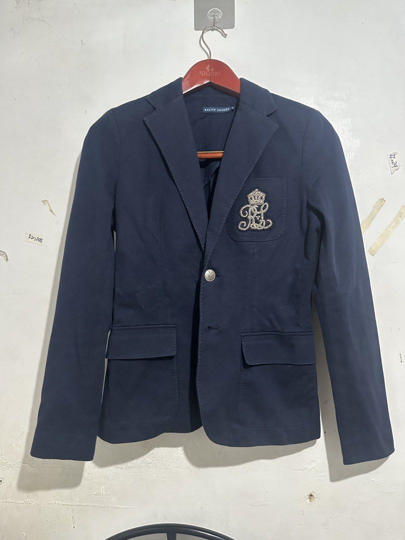 Ralph Lauren Navy Blue Crest Blazer Jacket Size 4 (Category: Coats, Jackets and Outerwear) located in Quezon City. Submitted by jeconiah.tayuman (Listing ID 1469661033, Image 1). Description: Size 4 17x25 Missing one button Excellent Condition DM 📩 Authentic Ralph Lauren navy blue blazer - Tailored fit with structured shoulders for a polished look - Distinctive embroidered crown and RL logo crest patch - Single front button closure with decorati