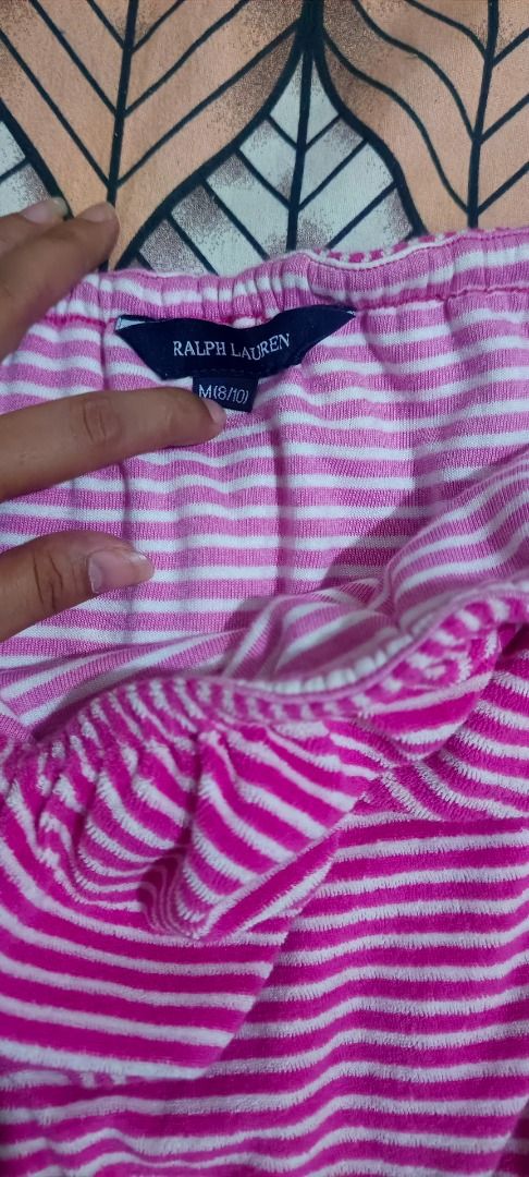 Ralph Lauren Pink Striped Strapless Romper M (Category: Rompers) located in Caloocan City. Submitted by gelie_29 (Listing ID 1469581698, Image 3). Description: - Brand: Ralph Lauren - Style: Strapless romper with cute ruffle top layer and convenient pockets - Pattern & Fabric: Bright pink and white stripes in a soft, cozy terry cloth towel texture - Fit: Elastic waist for comfort, size M (fits 8-10) - Details: Signature embroidered logo on the lo