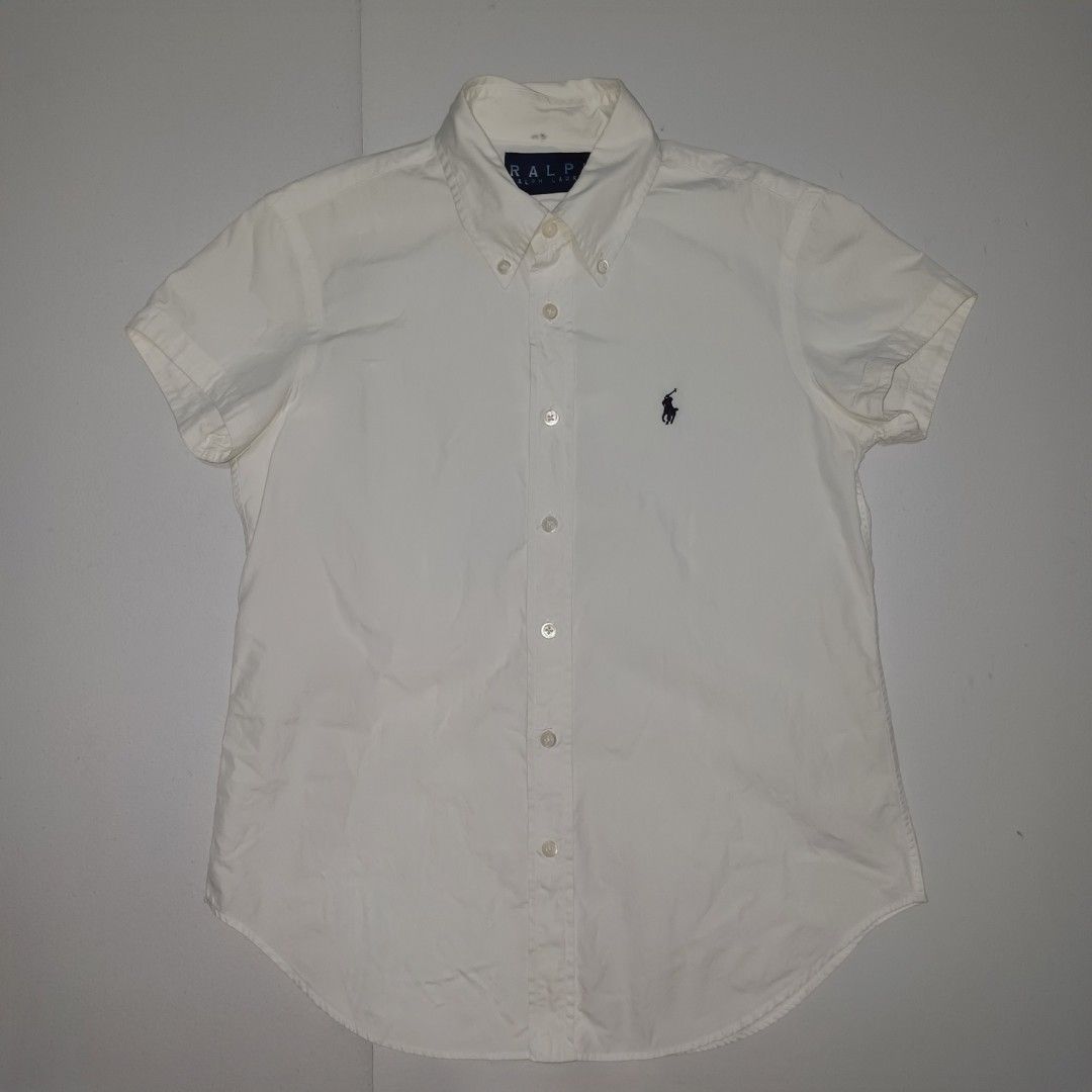 Ralph Lauren White Short Sleeve Button Down Shirt (Category: Shirts) located in Pasig City. Submitted by padillaaub64242 (Listing ID 1469640222, Image 1). Description: - Brand: Ralph Lauren - Color: Classic White - Size Small - 18×25 Inches.
