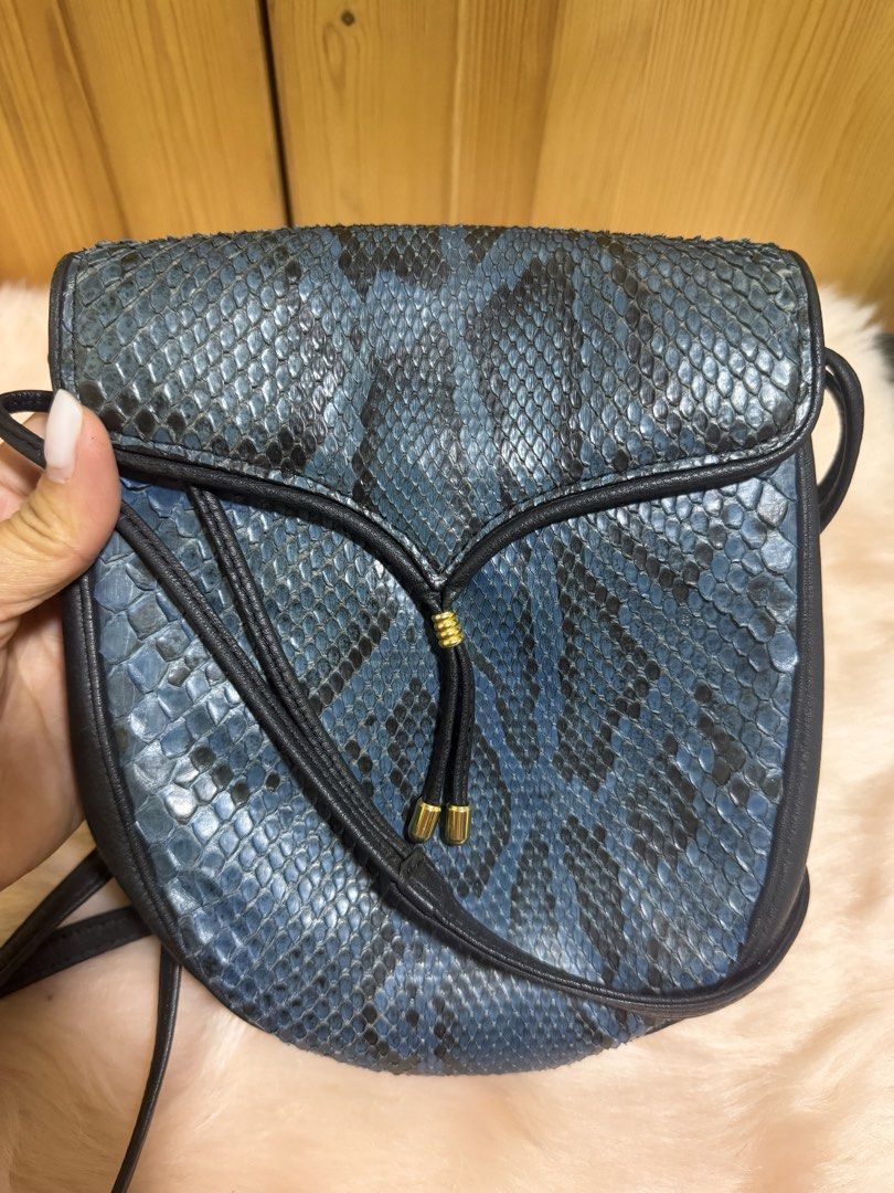 Rare Find! 🌌 Vintage Genuine Blue Python Crossbody Bag (Category: Cross-body Bags) located in Taguig. Submitted by titanars (Listing ID 1469594983, Image 2). Description: • Condition: Excellent vintage condition, scales are beautifully preserved. • Style: Perfect for Y2K, retro-glam, or adding an edgy pop of color to a minimal outfit. • Lightweight, long crossbody strap for all-day comfort. .