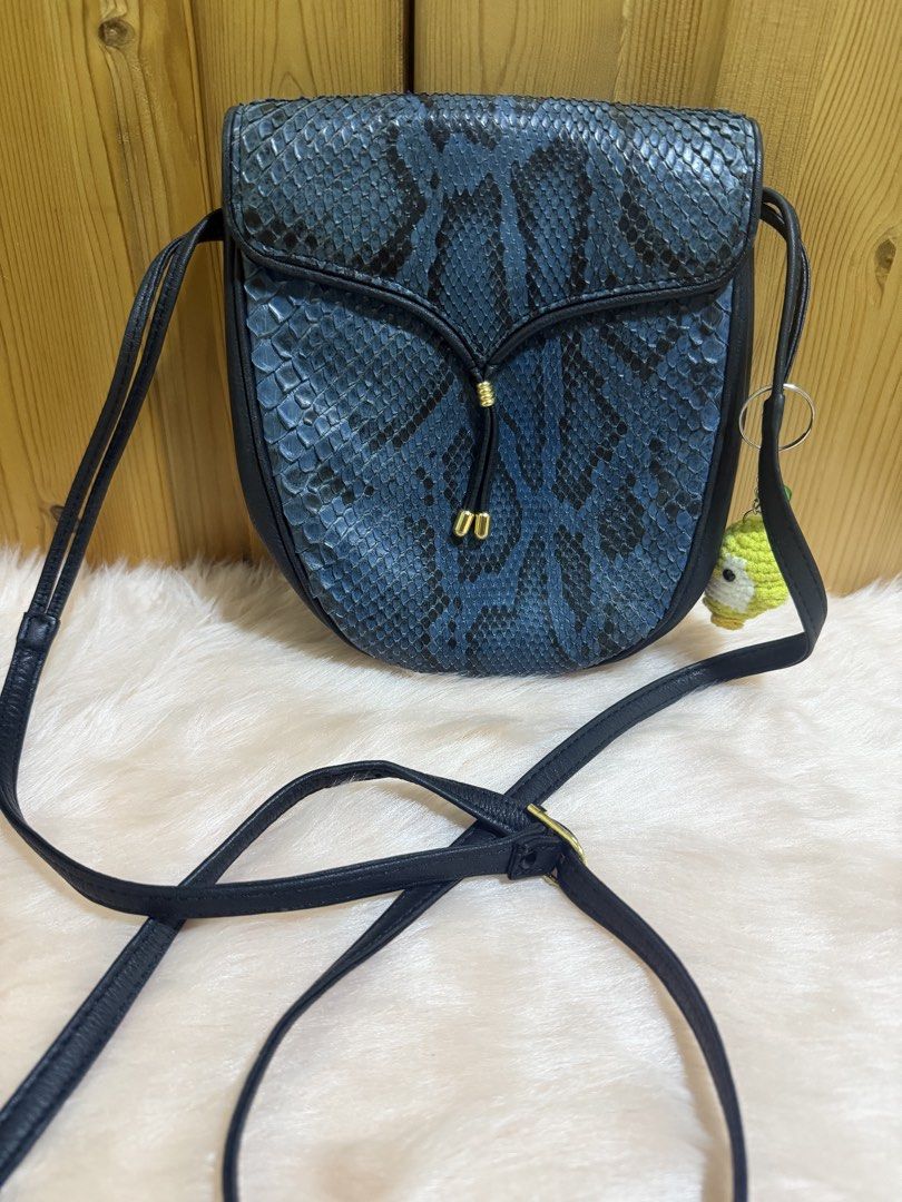 Rare Find! 🌌 Vintage Genuine Blue Python Crossbody Bag (Category: Cross-body Bags) located in Taguig. Submitted by titanars (Listing ID 1469594983, Image 1). Description: • Condition: Excellent vintage condition, scales are beautifully preserved. • Style: Perfect for Y2K, retro-glam, or adding an edgy pop of color to a minimal outfit. • Lightweight, long crossbody strap for all-day comfort. .