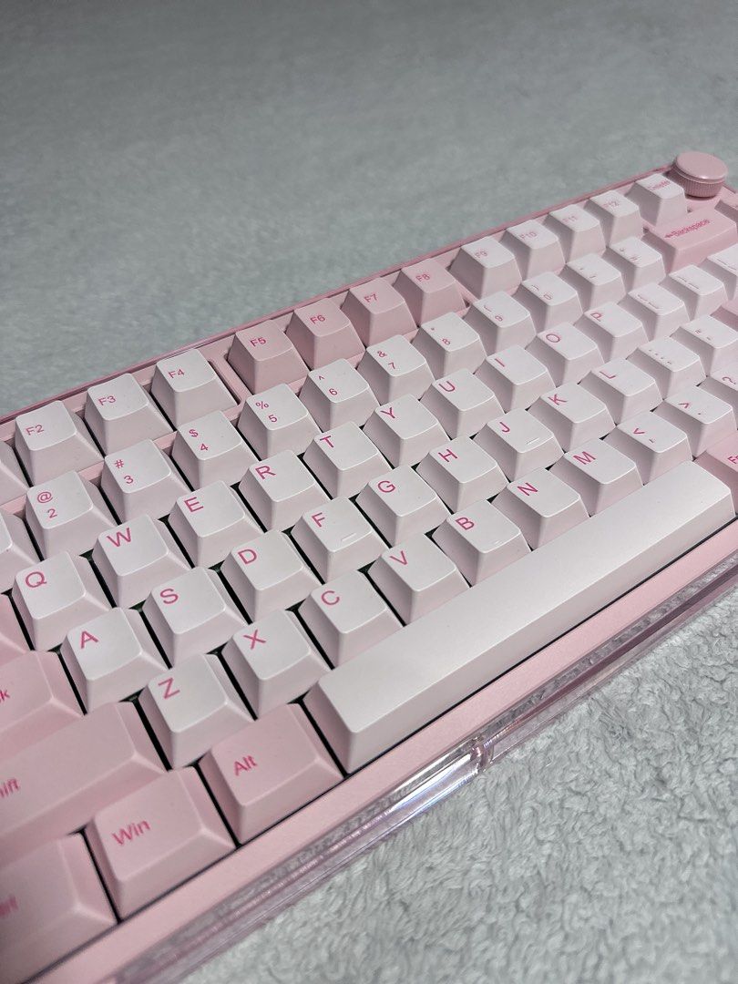 [RARE] Kiiboom Breeze75 Keyboard in Pink (Category: Computer Keyboard) located in Paranaque City. Submitted by hershey_august (Listing ID 1469678337, Image 2). Description: - Compact pink mechanical keyboard with a clean layout and dedicated function row - Eye-catching transparent pink acrylic case and custom pink keycaps - Convenient top-right volume knob for easy audio control - Vibrant RGB backlighting for a stunning aesthetic setup - Perfect 