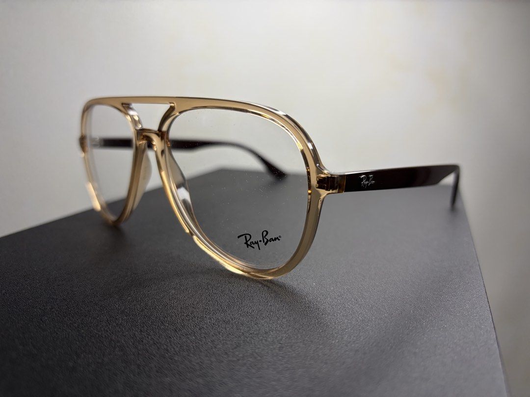 Ray-Ban Aviator Eyeglasses (Category: Sunglasses & Eyewear) located in Marikina City. Submitted by bbbiancsss (Listing ID 1469702489, Image 2). Description: Ray-Ban Transparent Brown Plastic Aviator Eyeglasses (Rb4376V817257) Frame Shape: Aviator Frame Color: Transparent Brown Lens Color: Clear Frame Type: Full Rim Material: Plastic Gender: Unisex Eyewear Size: 57-16-145 Lens Height: 51 Caliper: 145 Frame colour: Brown Frame material: Plastic Fra