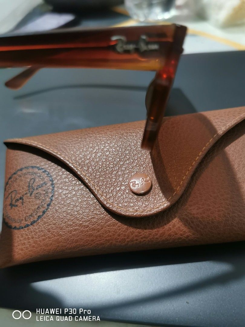 Ray-Ban Meteor (Category: Sunglasses & Eyewear) located in Makati City. Submitted by relianzmae57131 (Listing ID 1469697721, Image 3). Description: - Brand: Ray-Ban ideal for big or wide faces - Style: Classic Wayfarer - Frame: signature temple branding - Lenses: Dark tinted with top corner logo - Inclusion: Original brown leather case with snap button closure and embossed logo - Condition: Excellent / Well-maintained - Mode of Payment: BPI / GCa