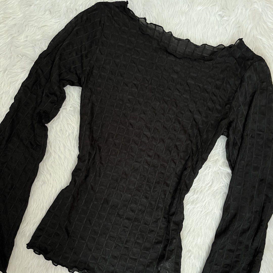 Raycavic Black Textured Long Sleeve Mesh Top (Category: Longsleeves) located in Maasin. Submitted by taraa18 (Listing ID 1469584371, Image 2). Description: - Brand: Raycavic - Color: Black - Material: Semi-sheer mesh with checkered texture (lots of stretch!) - Design: Fitted silhouette with trendy lettuce trim at neckline, cuffs, and hem - Condition: Worn just a couple of times, clean and well-maintained.