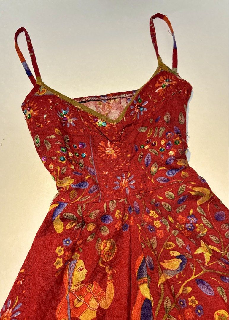 Red Indian Printed Spaghetti Strap Jumpsuit (Category: Jumpsuits) located in Bacolod City. Submitted by thlnn_vls (Listing ID 1469715545, Image 3). Description: - Vibrant red spaghetti strap jumpsuit with traditional Indian woman and animal prints - Eye-catching colorful sequin embellishments on the bodice and neckline - Scoop neck with thin adjustable straps for a custom fit - Trendy wide-leg cropped cut with a textured fabric weave - Fun and un