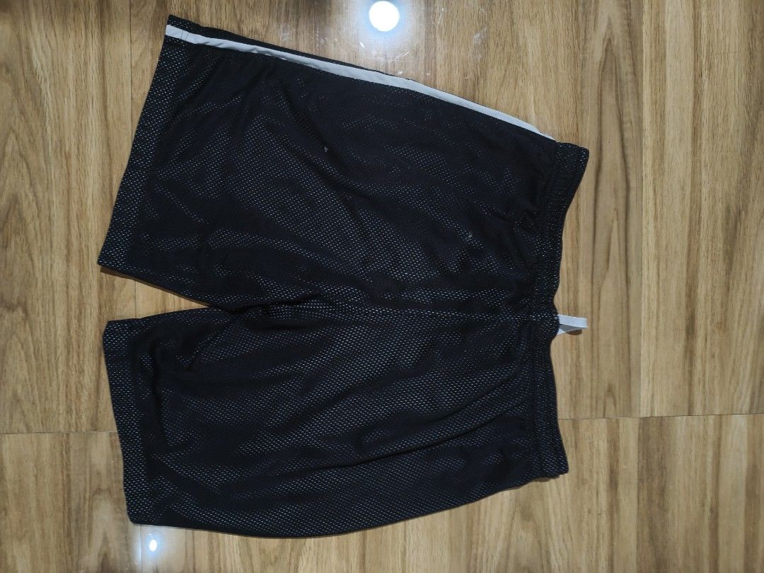 Reebok Black Mesh Athletic Shorts with Drawstring (Category: Shorts) located in Munoz. Submitted by toy_zone (Listing ID 1469672816, Image 2). Description: - Brand: Reebok - Color: Black - Material: Breathable athletic mesh fabric - Waistband: Elastic with all-over Reebok branding - Features: Adjustable white drawstring and stylish side stripe detail - Best for: Gym workouts, running, sports, or everyday lounging - Condition: Excellent / Well-mai