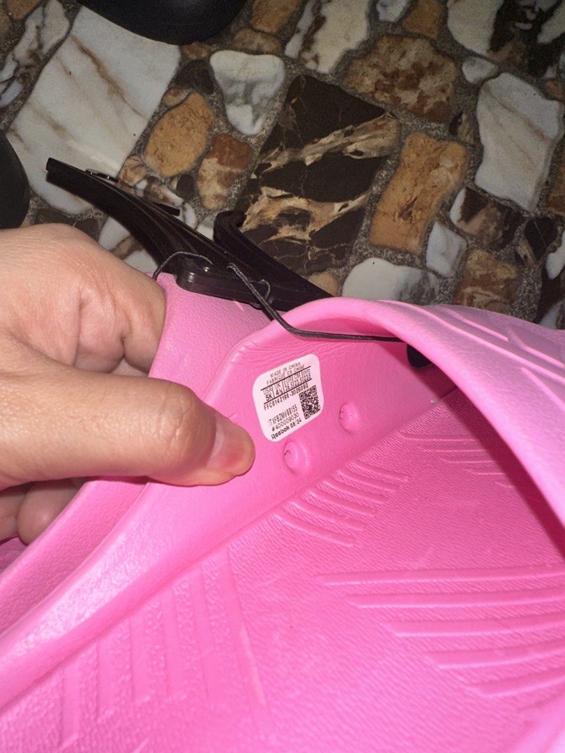 Reebok Pink Slides Sandals (Category: Slippers and slides) located in Bugallon. Submitted by lavenderlane (Listing ID 1469676224, Image 3). Description: - Brand new bright pink Reebok slides with original plastic hanger tag attached - Comfortable slip-on design perfect for daily wear - Features a textured footbed and durable outsole for added comfort and grip - Size details conveniently printed on the inner strap - Grab them while they are availa