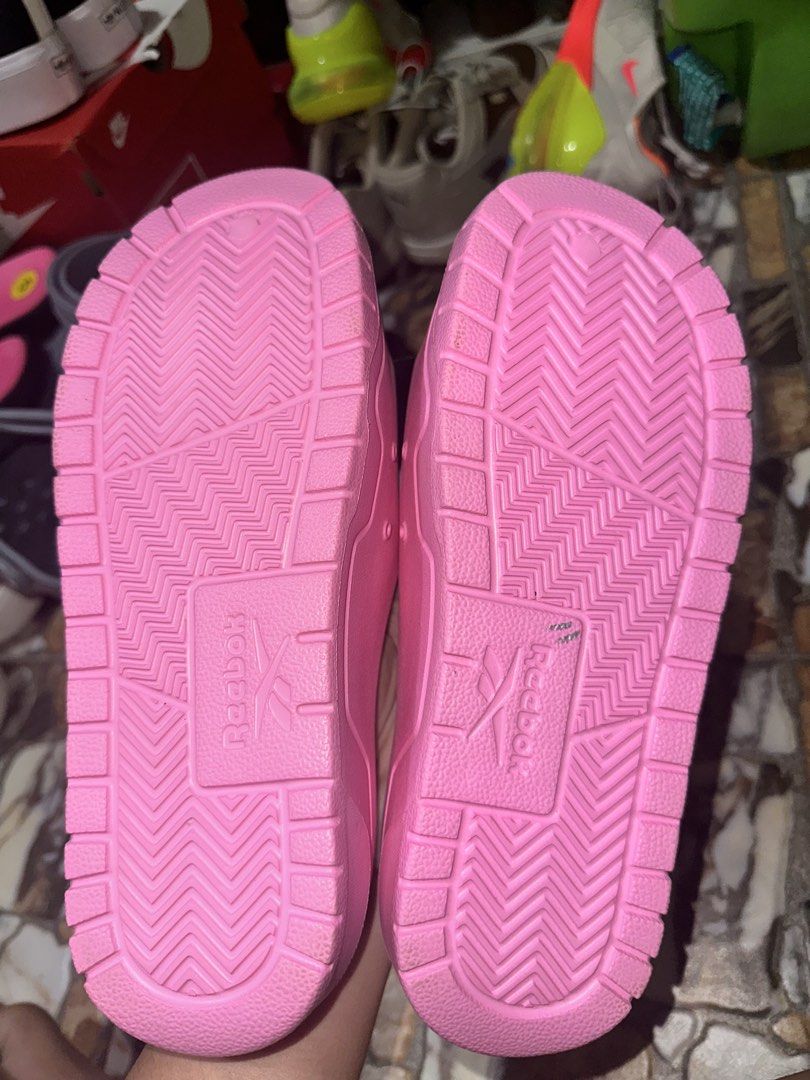 Reebok Pink Slides Sandals (Category: Slippers and slides) located in Bugallon. Submitted by lavenderlane (Listing ID 1469676224, Image 2). Description: - Brand new bright pink Reebok slides with original plastic hanger tag attached - Comfortable slip-on design perfect for daily wear - Features a textured footbed and durable outsole for added comfort and grip - Size details conveniently printed on the inner strap - Grab them while they are availa