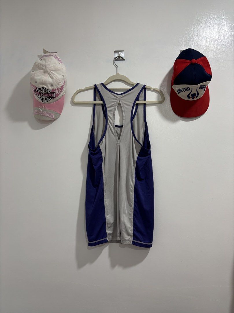 Reebok Workout Tank Top Gray Purple Size S (Category: Activewear) located in Calbayog City. Submitted by zaxcheus_castillo1708 (Listing ID 1469673718, Image 2). Description: - Brand: Reebok - Size: Small (tag shown in photos) - Color: Gray with purple trim and blue side panels - Design: Racerback with stylish back cutout, printed logo on chest - Material: Lightweight athletic fabric - Condition: Excellent, no damage noted - Ideal for: Gym workout