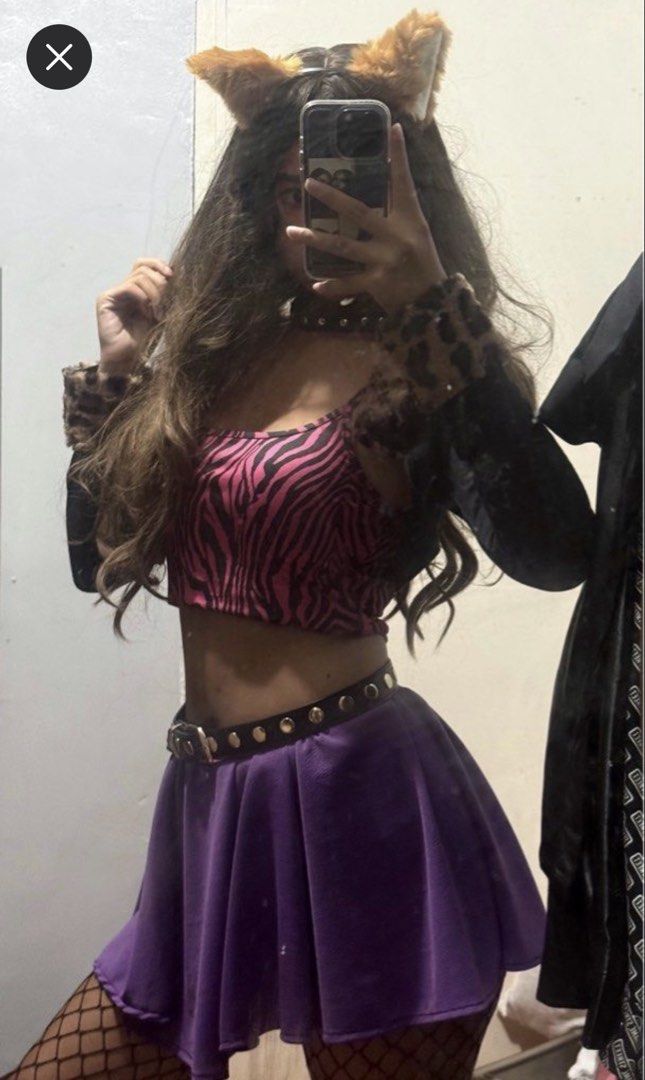 RENT: Monster High Clawdeen Wolf Costume (Category: Sets or Coordinates) located in Manila. Submitted by alexandrasaintmleux (Listing ID 1469721370, Image 2). Description: FOR RENT ONLY!! - Inclusions: zebra crop top, black sleeves with fur, and purple pleated skirt - Accessories included: wig, belt, choker, and wolf ears - if i don’t reply it means im on a reply quota so mssg me on my number instead :).