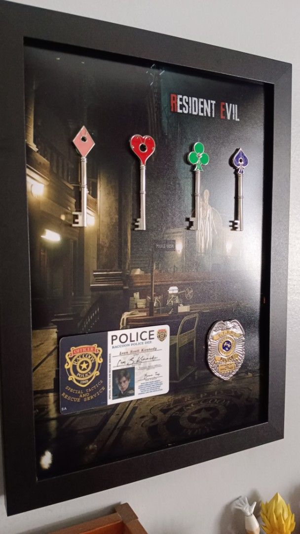 Resident Evil RPD Art frame (A4 size) (Category: Other Merchandise) located in Manila. Submitted by Drumsticx (Listing ID 1469676454, Image 3). Description: Resident Evil RPD Art frame (A4 size) - RPD Metal keys - Leon Kennedy ID (PVC) - STARS Metal Badge Price: 1600php Manila Location.