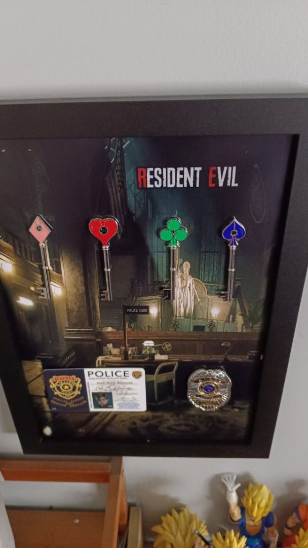 Resident Evil RPD Art frame (A4 size) (Category: Other Merchandise) located in Manila. Submitted by Drumsticx (Listing ID 1469676454, Image 2). Description: Resident Evil RPD Art frame (A4 size) - RPD Metal keys - Leon Kennedy ID (PVC) - STARS Metal Badge Price: 1600php Manila Location.
