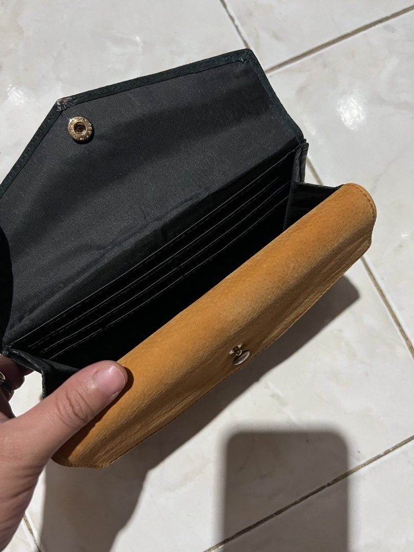 Riccini Mmo Wallet (Category: Luxury Bags & Wallets) located in General Santos City (Dadiangas). Submitted by queenfinds (Listing ID 1469713248, Image 2). Description: a brand of genuine leather and suede wallets, particularly known for layered, multi-compartment or multi-tier snap-closure long wallets made in Japan. Product Type: Leather and suede wallets / long wallets Design Features: Multi-layer or 3-tier/4-tier stacked compartment structures