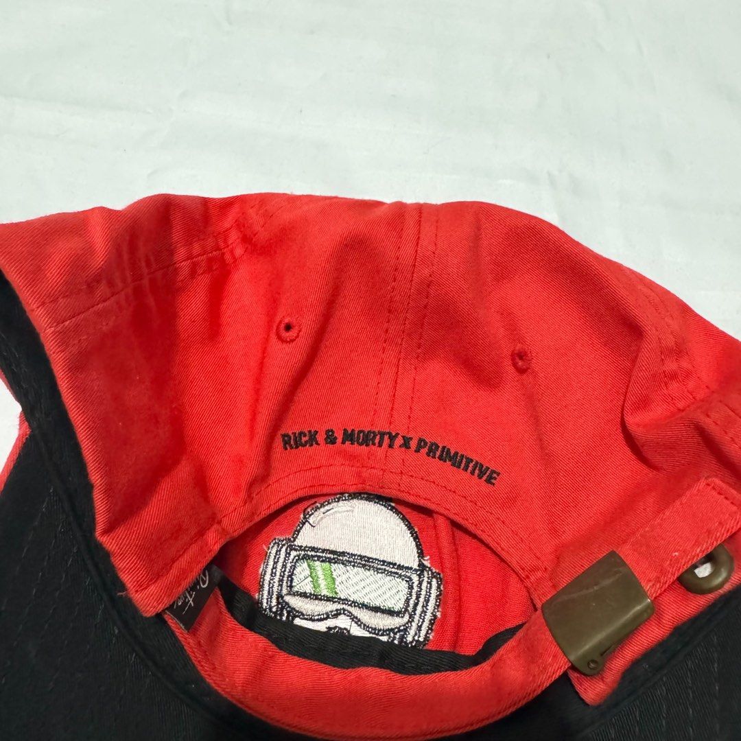 Rick and Morty x Primitive Red Cap (Category: Caps & Hats) located in Manila. Submitted by safeowl.b6dbb0 (Listing ID 1469605922, Image 3). Description: - Official Rick and Morty x Primitive collaboration cap in bright red - Eye-catching embroidered character graphic on the front - Text embroidery above the back strap opening - Adjustable metal strap closure for a custom fit - Authentic black inner taping with 2018 Cartoon Network tag - Comfortab