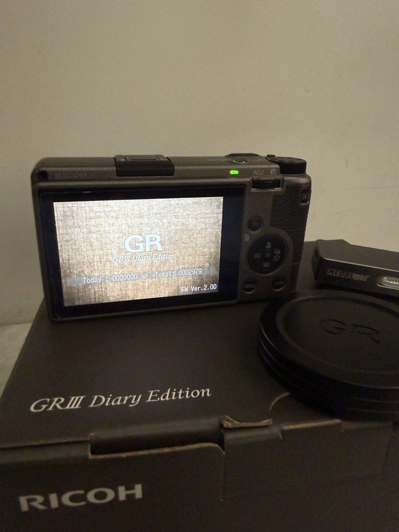 Ricoh GRIII Diary Edition with Freebies (Category: Cameras) located in Manila. Submitted by mackyle (Listing ID 1469659410, Image 3). Description: Model: Ricoh GRIII Diary Edition Type: Compact Digital Camera with latge sensor and fixed prime lens Condition: Fully Functional, Clean Glass, Minimal Body Wear, Minimal Scratches at Hot-shoe Included: Box, Receipt, Black Pouch, Hand Strap, Power Adapter, Charging Cable, Medal Light Mini Flash, Ricoh B