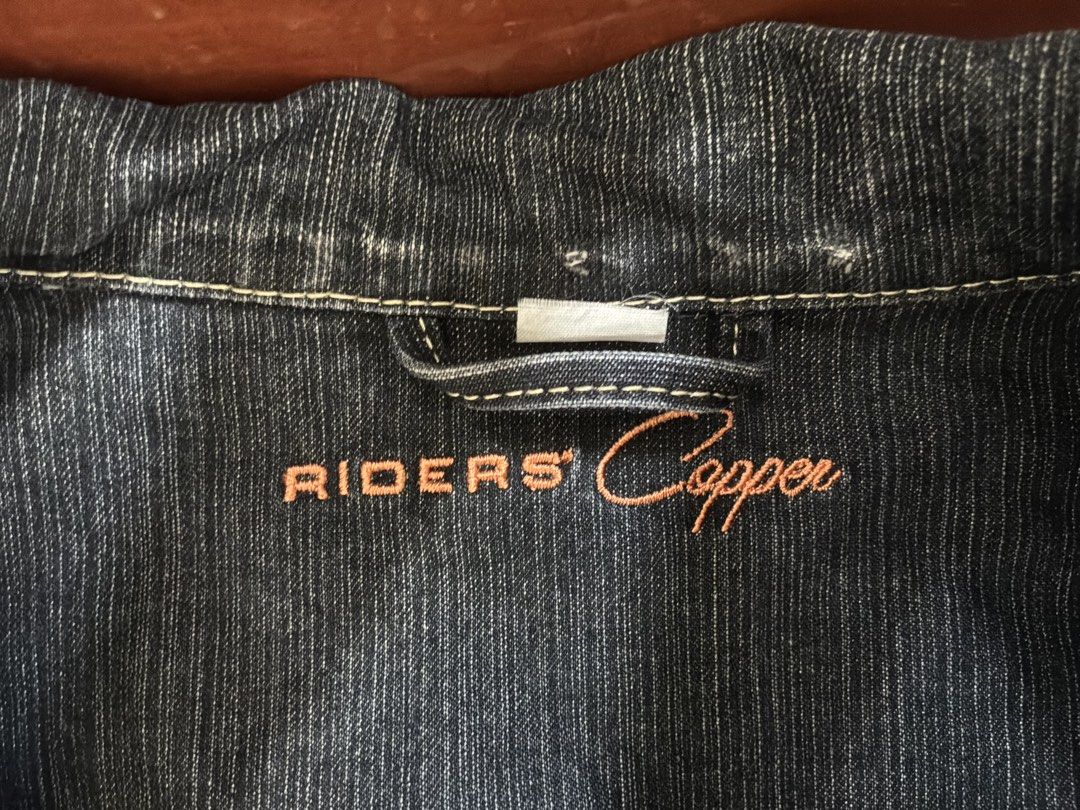 RIDERS Copper Denim Jacket Dark Blue (Category: Coats, Jackets and Outerwear) located in Dumaguete. Submitted by _l1lyy_ (Listing ID 1469631053, Image 2). Description: - Denim is still in very good condition, no flaws - Brand: RIDERS Copper - Color: Dark blue with contrasting stitch details - Material: Structured denim - Design: Button-up front with metal buttons and classic collar - Pockets: Functional chest flap pockets and side pockets - Style