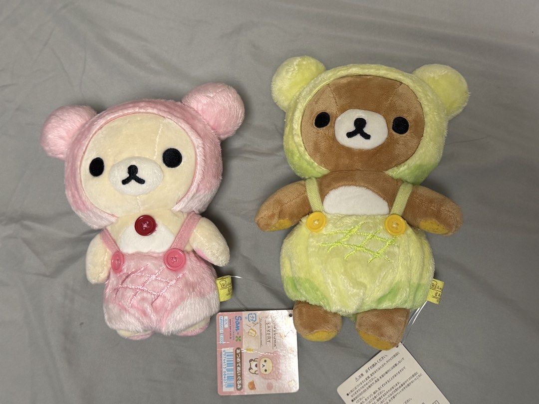 Rilakkuma Bakery Plush Set (Category: Plushies & Soft Toys) located in Iguig. Submitted by gtonsukiex (Listing ID 1469602466, Image 1). Description: - Authentic San-X Rilakkuma Bakery series plush set - Includes 2 plushies: Pink Korilakkuma (hooded outfit) and Brown Rilakkuma (baker's outfit) - Condition: Brand new with original tags attached - Super soft, high-quality plush material - Sourced as authentic Japanese prizes - Great for Rilakkuma co