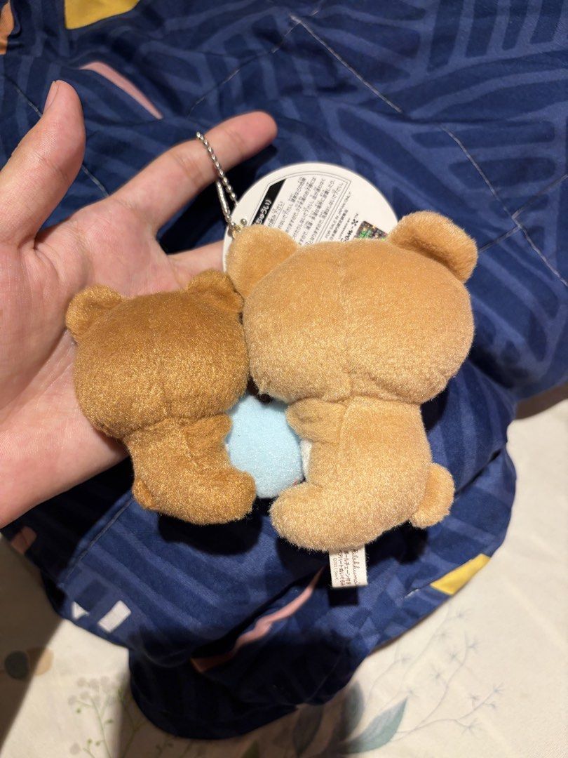 Rilakkuma Pair Heart Plush Keychain (Category: Plushies & Soft Toys) located in Makati City. Submitted by squishycorner (Listing ID 1469714359, Image 2). Description: - Item: Official San-X Rilakkuma & Korilakkuma plush keychain - Design: The pair is holding a cute light blue heart together - Condition: Brand new, clean, fluffy, and stored away from dust - Inclusions: Original tag still attached and silver ball chain included - Perfect for bag ch
