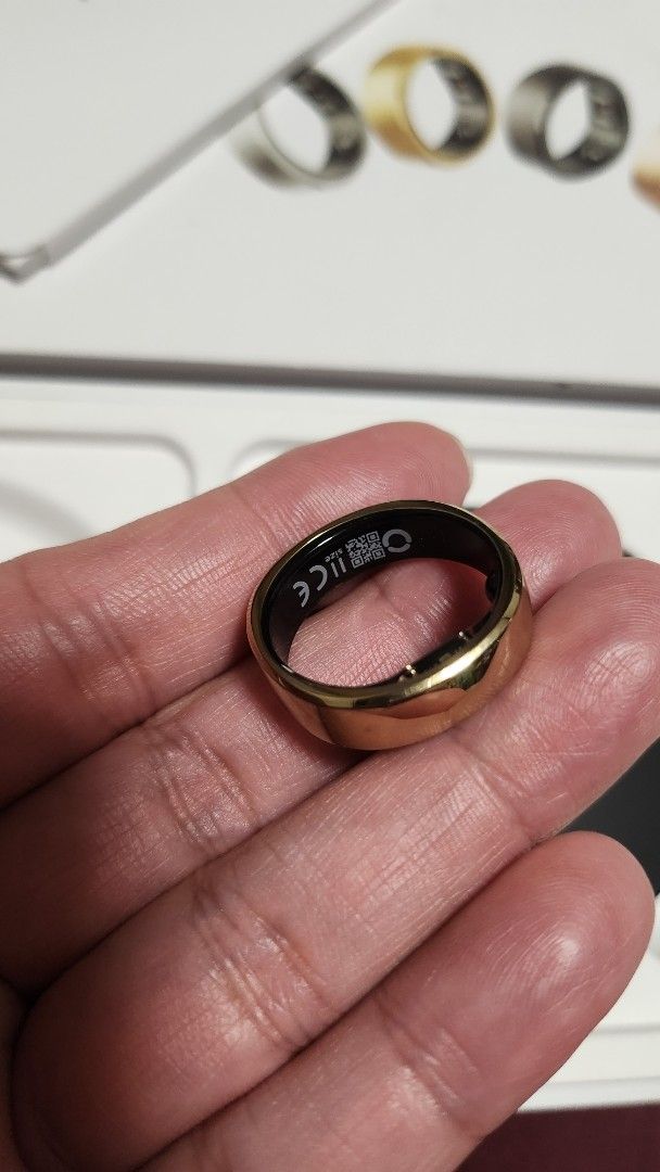 RingConn Smart Ring Royal Gold Gen 2 (Category: Rings) located in Manila. Submitted by jmgco (Listing ID 1469607542, Image 3). Description: - RingConn Smart Ring Gen 2 - Color: Royal Gold Size 11 - Condition: Used good condition - Issue: battery life last only 2 days - Inclusions: Complete set with original packaging, charging case, and cable - Features: Tracks sleep / apnea, activity, and vital signs - pick up at grace park caloocan/potrero mala