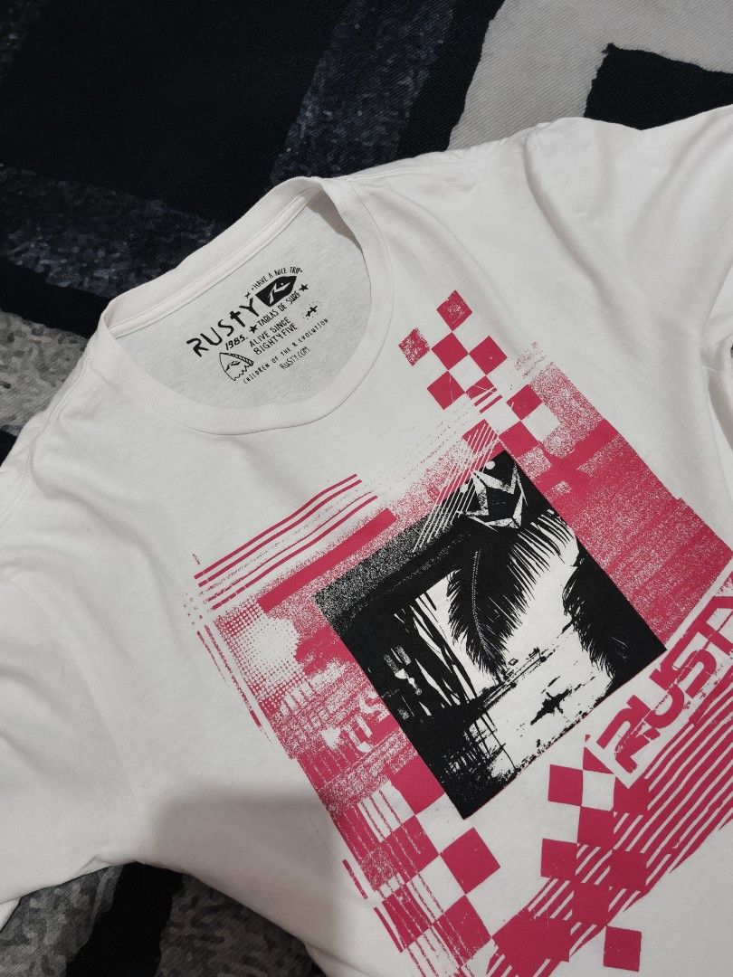Rusty White Graphic Tee Surf Skate Streetwear (Category: Tshirts & Polo Shirts ) located in Andop. Submitted by kyutoryuu (Listing ID 1469582014, Image 2). Description: Rusty Graphic Tee •Dimes: 19x27 •Condition: Excellent •CR: 9.5/10 •Issue: need rewash.
