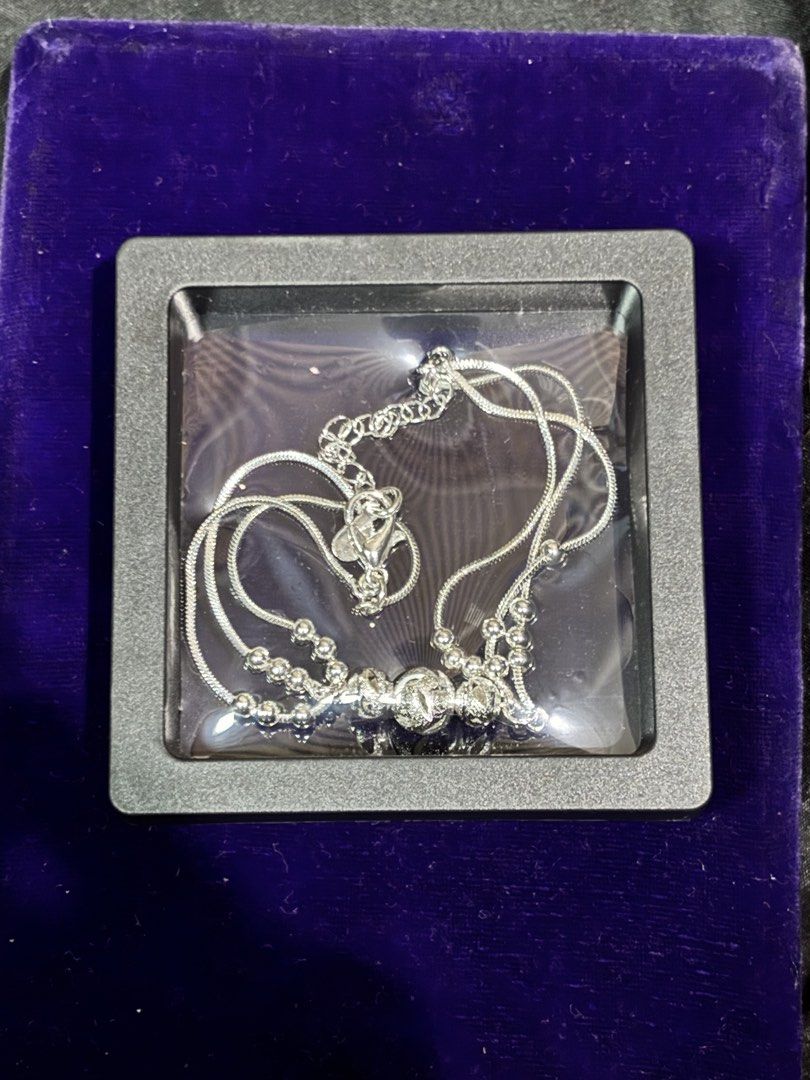 S925 Sterling Silver Multi-Strand Charm Bracelet (Category: Bracelets) located in Caloocan City. Submitted by berndale_closet (Listing ID 1469586941, Image 3). Description: - Material: Genuine S925 sterling silver (stamped on clasp tag) - Design: Multi-strand snake chain with decorative textured beads and central sphere - Fit: Adjustable length with secure lobster clasp and chain extension - Packaging: Includes a classy black display box with a c