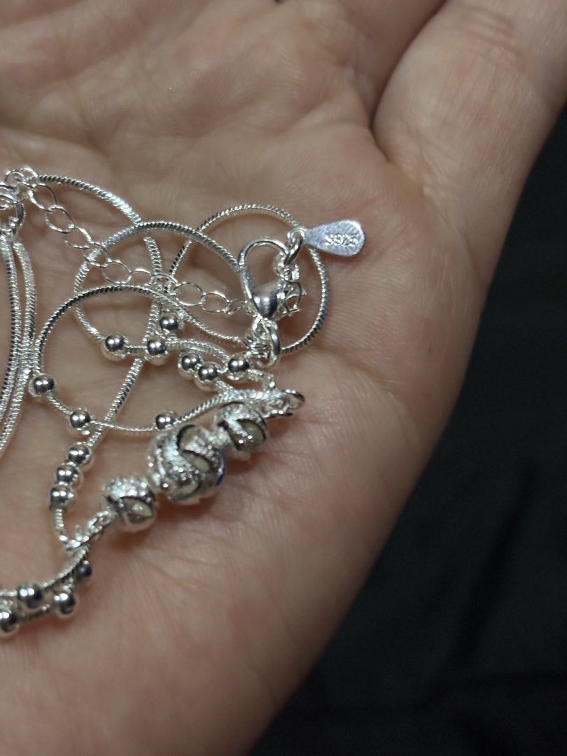 S925 Sterling Silver Multi-Strand Charm Bracelet (Category: Bracelets) located in Caloocan City. Submitted by berndale_closet (Listing ID 1469586941, Image 2). Description: - Material: Genuine S925 sterling silver (stamped on clasp tag) - Design: Multi-strand snake chain with decorative textured beads and central sphere - Fit: Adjustable length with secure lobster clasp and chain extension - Packaging: Includes a classy black display box with a c