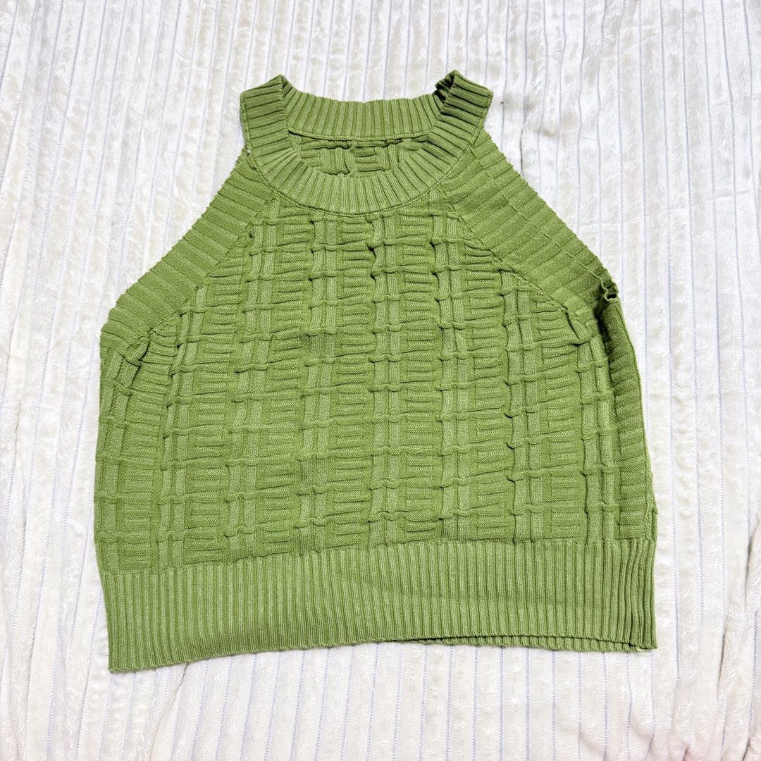 Sage Green Textured Tank Top (Category: Sleeveless) located in Manila. Submitted by ish.vintage (Listing ID 1469722494, Image 1). Description: - Color: Sage green - Material: Stretchy textured knit fabric - Design: Halter top with sleeveless cut, high neckline, and ribbed collar and hem - Styling: Perfect for warm days or layering; pairs great with high-waisted jeans or skirts - Condition: Clean, well-maintained 📍Project 7, QC 🚚 Shipping should