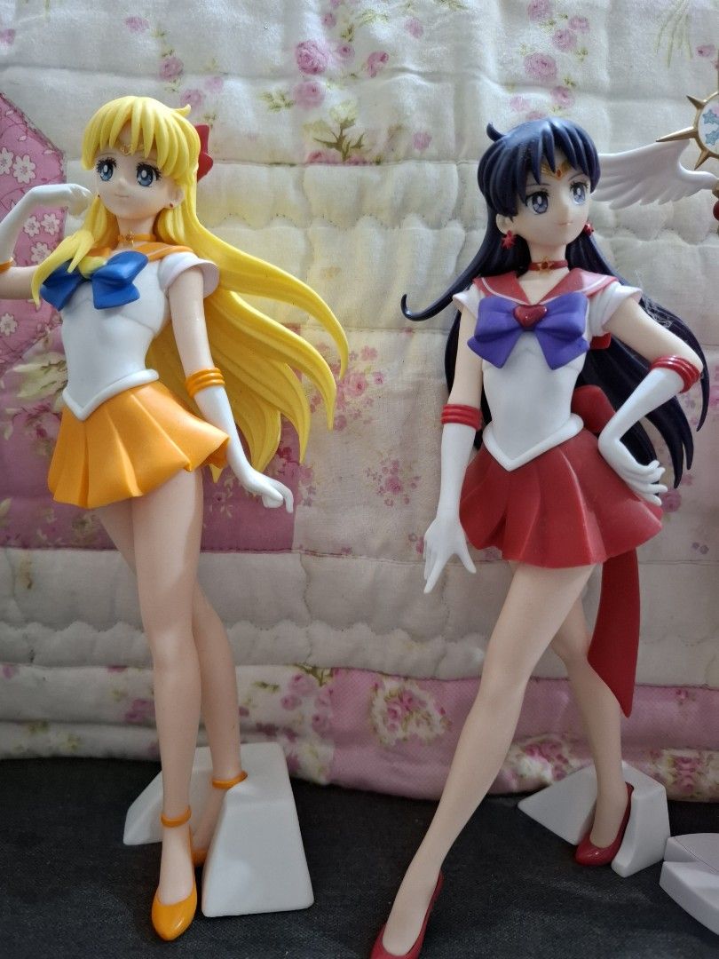 Sailor Mars and Sailor Venus Anime Figures (Category: Figurines & Statues) located in Orion. Submitted by timburtonfan (Listing ID 1469575512, Image 1). Description: - Set of 2 Sailor Moon figures: Sailor Mars and Sailor Venus - Detailed uniforms and faces with great paint quality - Includes white display stands for stability - Clean condition, from a smoke-free home - Ideal for collectors and fans.