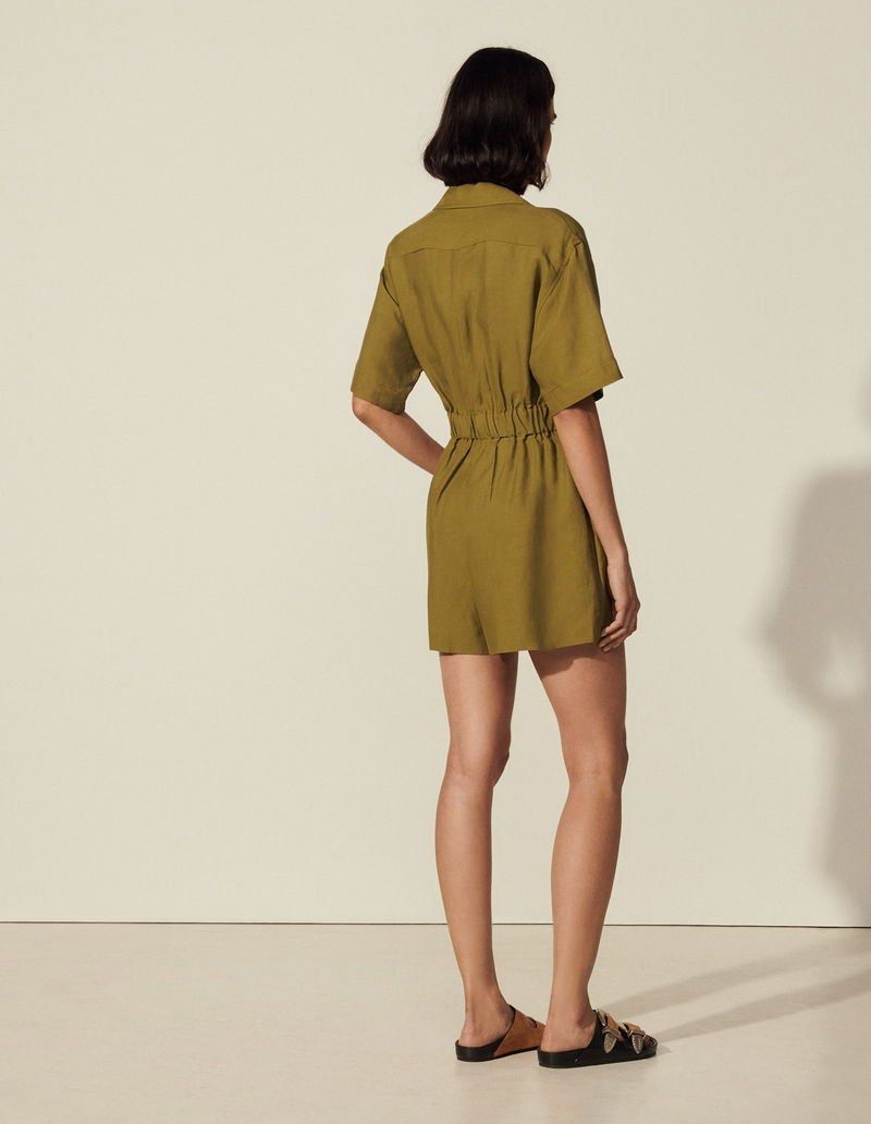 SANDRO Paris linen blend Playsuit 36 (Category: Rompers) located in Rosales. Submitted by dariang22 (Listing ID 1469600426, Image 3). Description: - Brand: Sandro - Color: Olive green - with side pockets - Style: Short-sleeve collared playsuit with front button closure - Details: Distinctive gold-toned hardware - Fit: Comfortable elasticated waist with short-cut bottoms -linen blend .