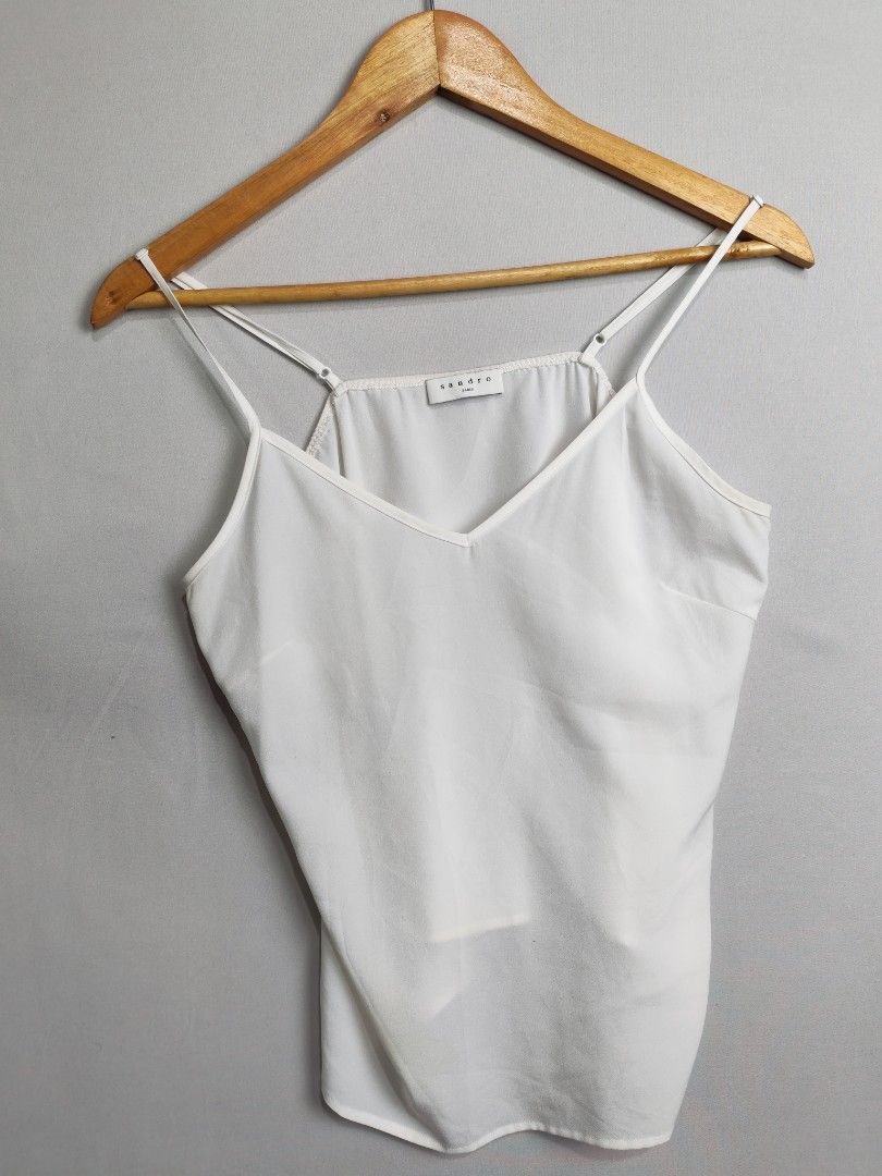 Sandro White Silk Top (Category: Sleeveless) located in Baguio. Submitted by luxuryph2600_eric (Listing ID 1469590590, Image 2). Description: Sandro White Silk Top 📌 Details⬇️⬇️⬇️ 📍Excellent Condition 📍Dimes Check Pics 📍Color Rate 10/10 📍Size Medium 💰 PRICE 500 FREE SHIPING 📌Loc. Baguio City Shipping Via J&T Reminder : Items are Thrifted and carefully Selected from Thrift Stores/Box/Bales Photos are Provided for Self Authentication No Retu