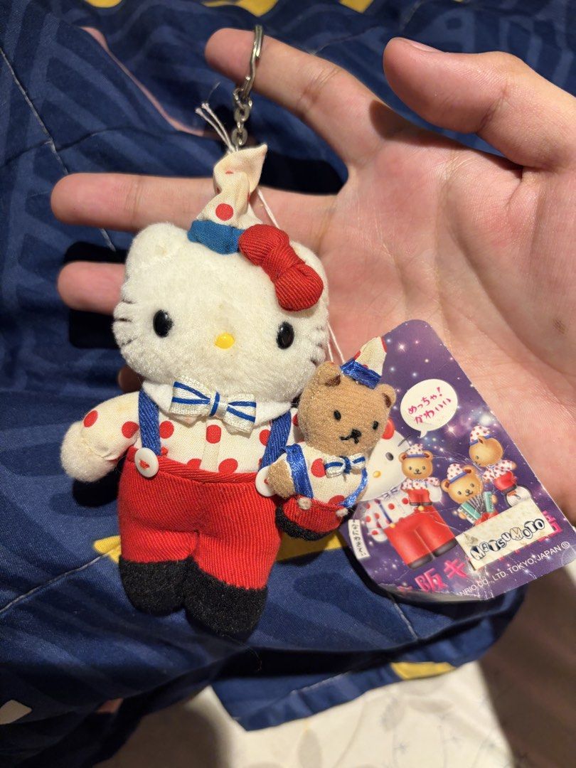 Sanrio Hello Kitty and Teddy Bear Plush Keychain (Category: Plushies & Soft Toys) located in Makati City. Submitted by squishycorner (Listing ID 1469713848, Image 1). Description: - Rare Japanese import Sanrio Kitty plush keychain - Wears adorable red and white polka dot overalls with a matching hat - Includes an attached tiny companion teddy bear keychain - Original tag still attached - Perfect rare collectible piece for Kitty fans.