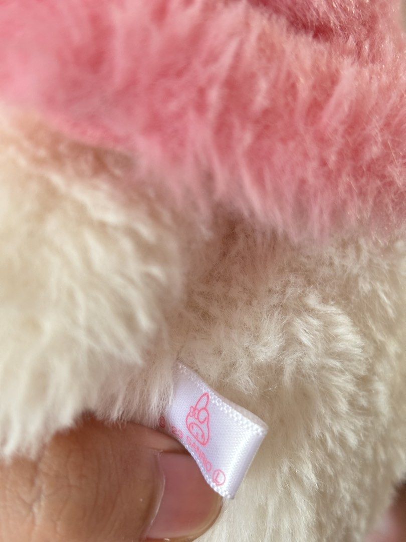 Sanrio My Melody Posture Pal (Category: Plushies & Soft Toys) located in Abucay. Submitted by leeeeeeeeeeen (Listing ID 1469592354, Image 3). Description: - Official Sanrio My Melody plush toy with 2023 tag attached - Features a soft pink hood adorned with a sweet blue bow - Pristine, clean condition from a smoke-free environment - Ideal gift or addition to any Sanrio collection.