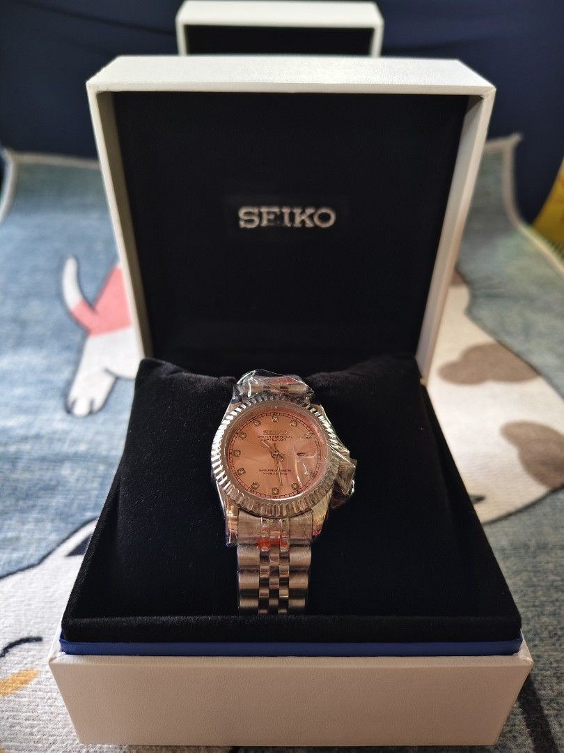 Seiko Datejust Rose Gold Watch with Box custom mod automatic (Category: Luxury Watches) located in Manila. Submitted by rarewind.cb1244 (Listing ID 1469641696, Image 1). Description: - Authentic rose gold Seiko wristwatch - Stunning pink dial with sparkling diamond index markers - Classic fluted bezel and comfortable jubilee bracelet - Practical date window with cyclops lens at 3 o'clock - Brand new, still wrapped in original protective plastic -