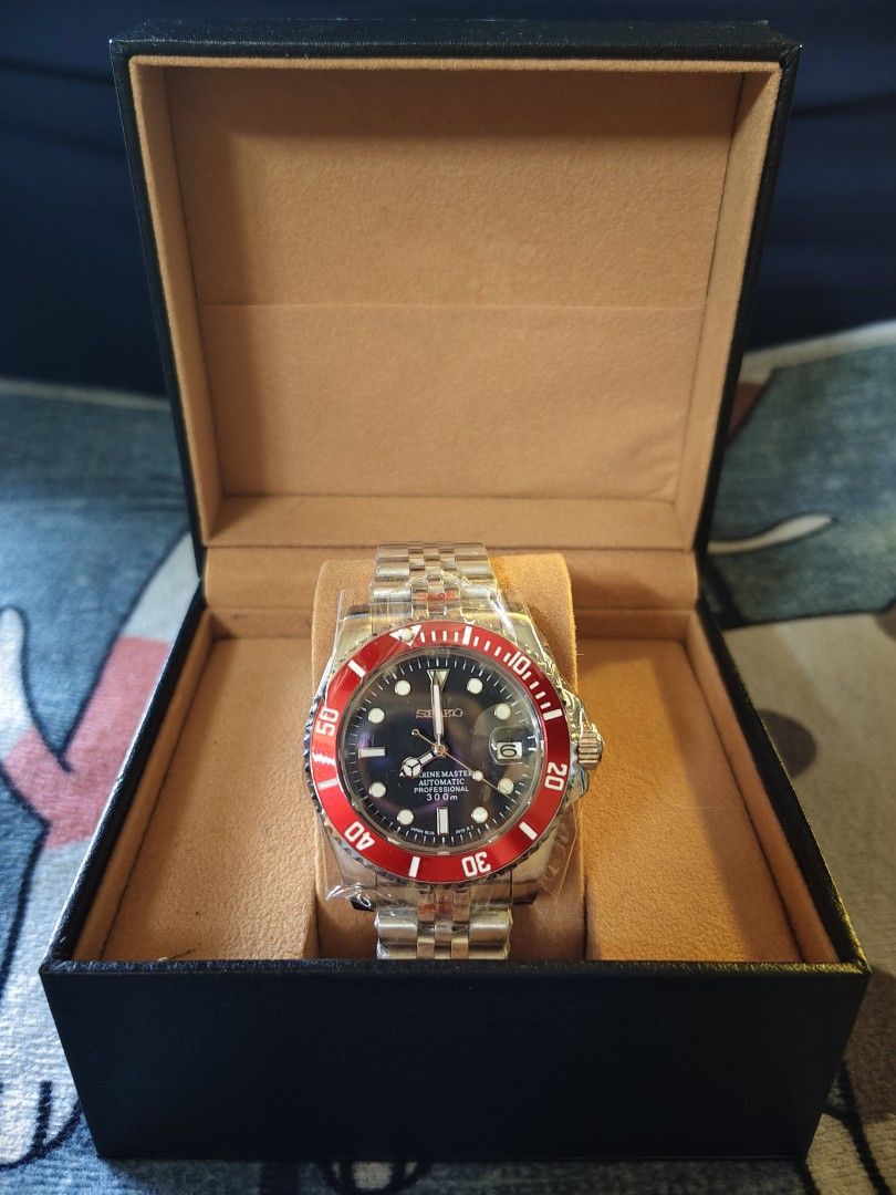 Seiko Marine Master Professional 300m Watch with Red Bezel custom mod automatic (Category: Men's Watches) located in Manila. Submitted by rarewind.cb1244 (Listing ID 1469644447, Image 1). Description: - Model: Seiko Marine Master Professional 300m Automatic - Dial: Black with 3 o'clock date window - Bezel: Striking red rotating bezel - Bracelet: Silver stainless steel jubilee bracelet (still in protective plastic) - Packaging: Includes black pres