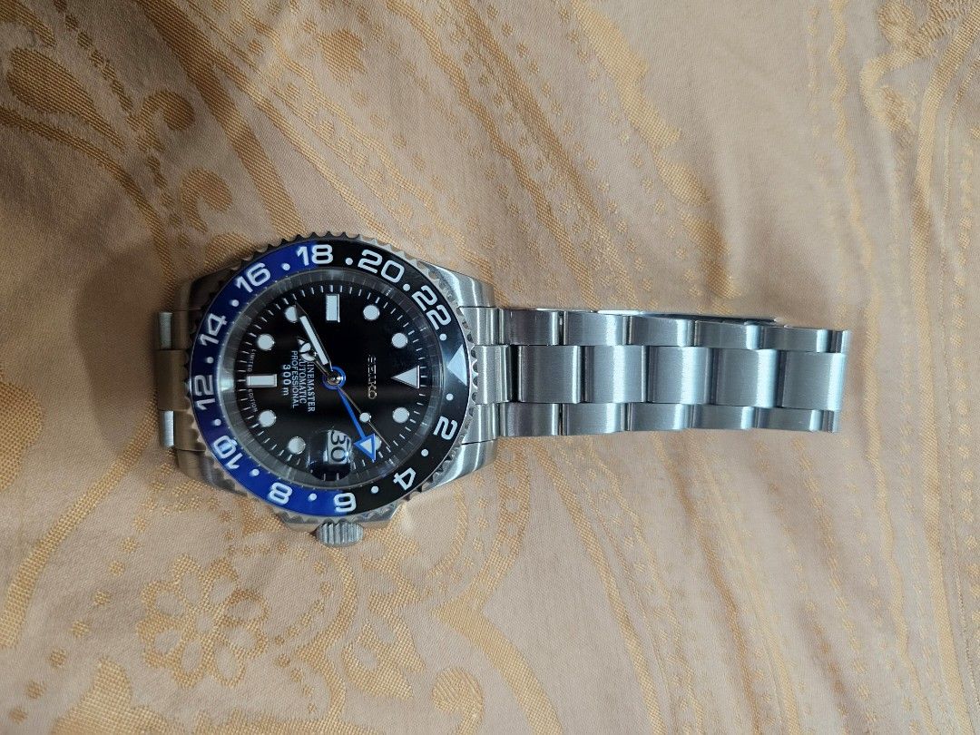 Seiko Marinemaster Professional GMT Automatic Watch (Category: Men's Watches) located in Quezon City. Submitted by ryanstuff.ph (Listing ID 1469579817, Image 3). Description: - Model: Seiko Marinemaster Professional - Movement: Automatic - Water Resistance: 300m - Dial & Bezel: Black dial with a blue and black bezel - Bracelet: Steel oyster-style bracelet with deployment clasp - Features: Date window with magnifier, solid steel case back - Condit