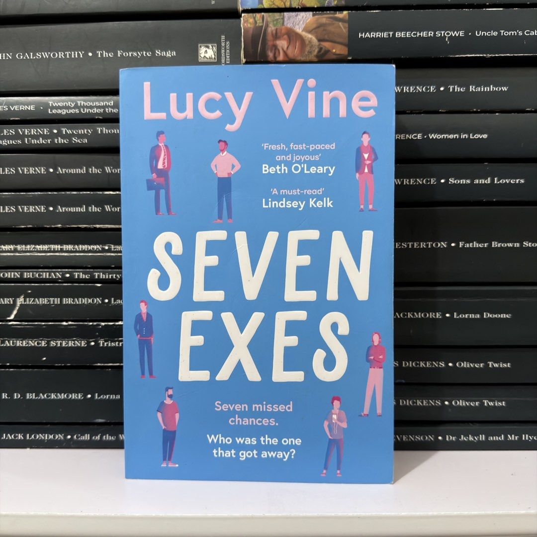 Seven Exes by Lucy Vine Paperback Book (Category: Storybooks) located in Lingayen. Submitted by readwjane (Listing ID 1469592096, Image 1). Description: - Title: Seven Exes by Lucy Vine - Format: Paperback edition - Design: Blue cover with illustrated characters - Genre: Entertaining contemporary fiction about past relationships - Condition: Clean pages, ready for your next reading session.