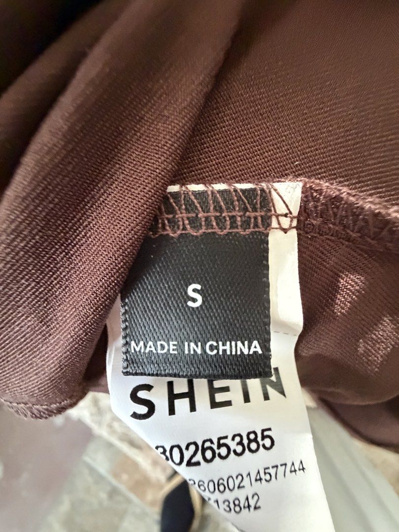 SHEIN Brown One-Shoulder Maxi Dress Size S (Category: Dresses) located in Santa Rosa. Submitted by martess (Listing ID 1469590077, Image 2). Description: - Brand: SHEIN - Color: Brown - Size: Small - Style: One-shoulder maxi dress with a layered cape overlay - Fit: Fitted silhouette, midi to maxi length depending on height - Material: Stretchy jersey knit fabric - Closure: Slip-on style (no zippers or buttons).
