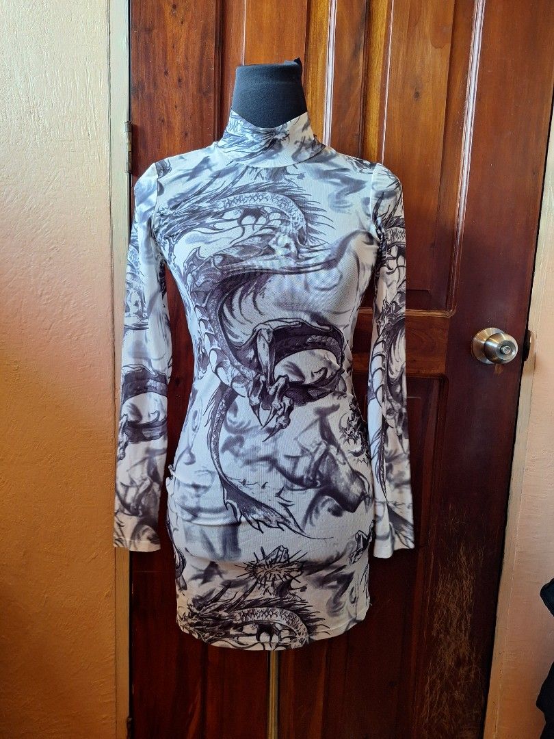 SHEIN Dragon Print Mesh Long Sleeve Top (Category: Longsleeves) located in Balamban. Submitted by ubethan (Listing ID 1469585392, Image 1). Description: - Brand: Shein - Size: XS - Condition: Brand new with tag, unworn - Design: Grey and white dragon graphic print all over - Features: Long sleeves, mock neck collar, super stretchy, semi-sheer fabric - Style: Great basic for layering or standalone wear.
